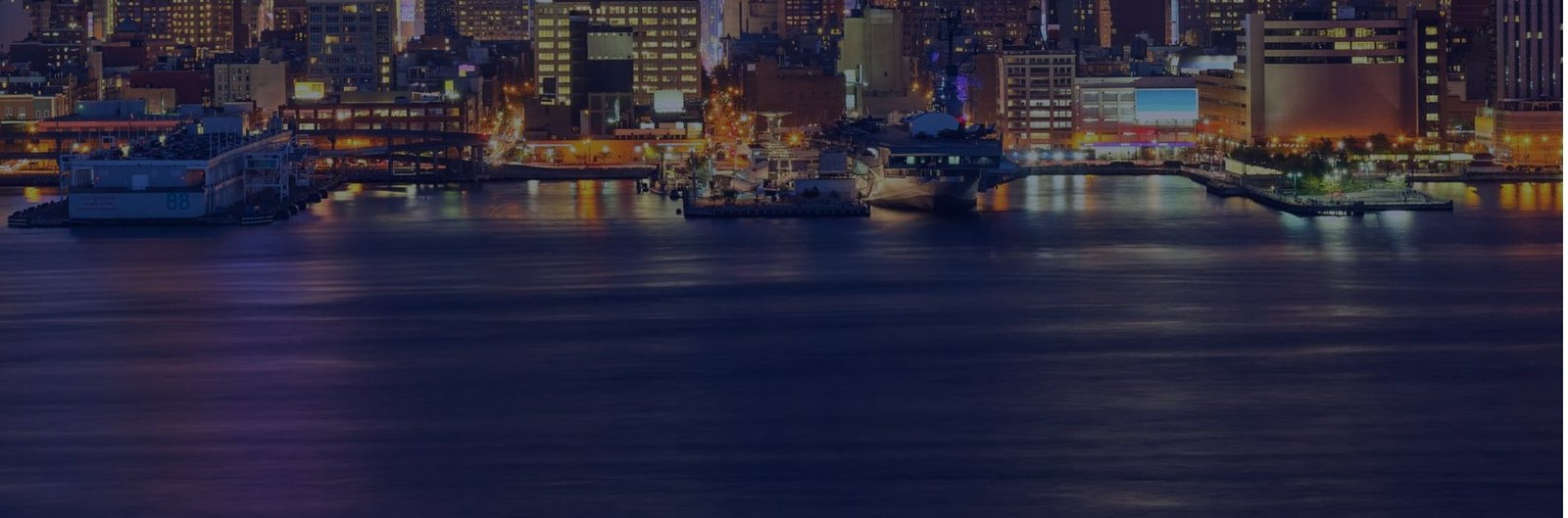 City waterfront lit up at night